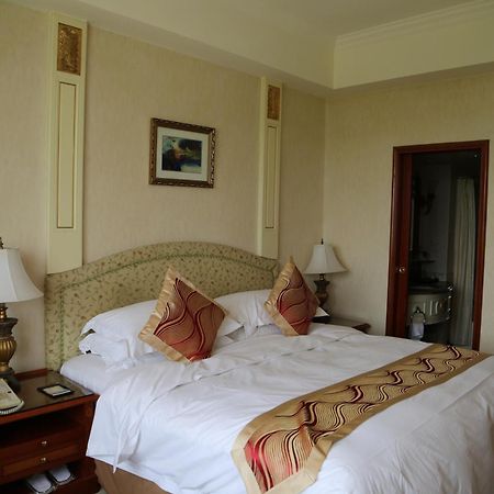 Huiquan Dynasty Hotel Qingdao Quarto foto